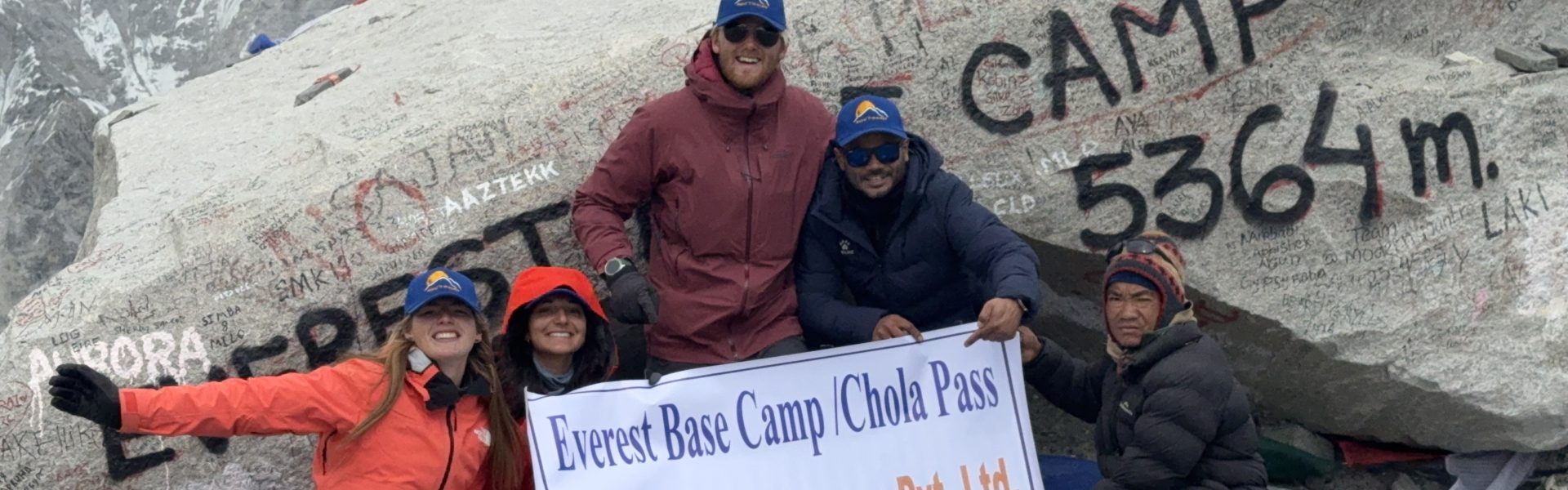 ajit-adhikari-with-his-trekkers-at-the-everest-base-camp-stone