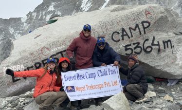 ajit-adhikari-with-his-trekkers-at-the-everest-base-camp-stone
