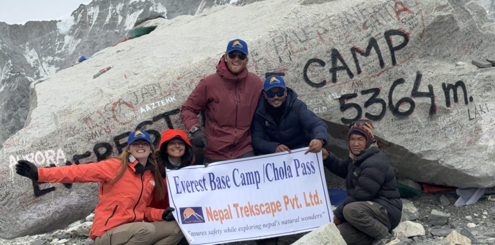 ajit-adhikari-with-his-trekkers-at-the-everest-base-camp-stone