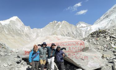 Lead guide Ajit with his guests at Everest Base Camp