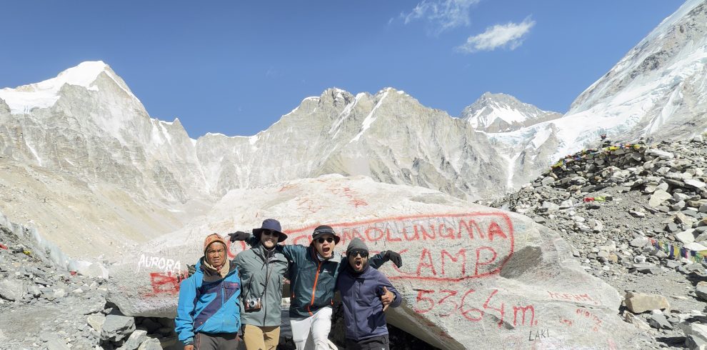 Lead guide Ajit with his guests at Everest Base Camp