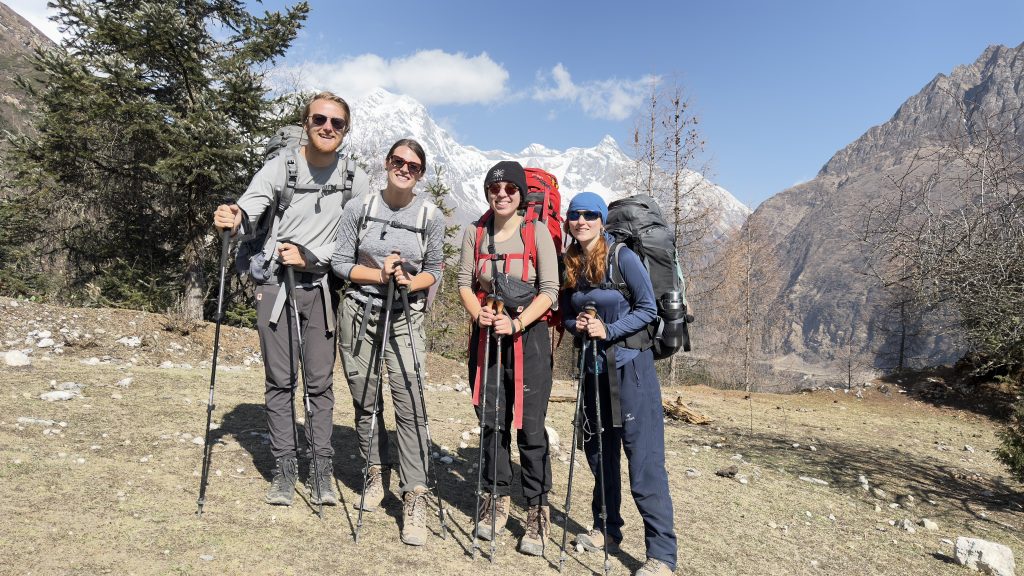 Trekkers of Nepal Trekscape standing on the trail following Sama Gaun