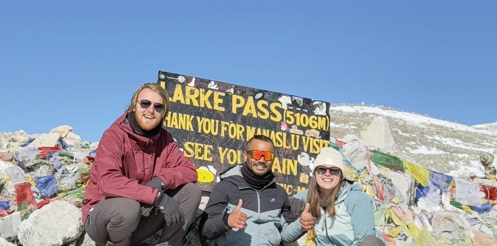 Lead guide Ajit with his guests at Larkya La Pass
