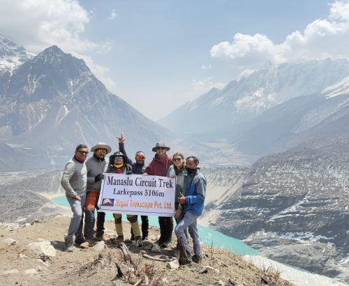trekkers holding banner of Nepal Trekscape on the way of Manaslu Base Camp