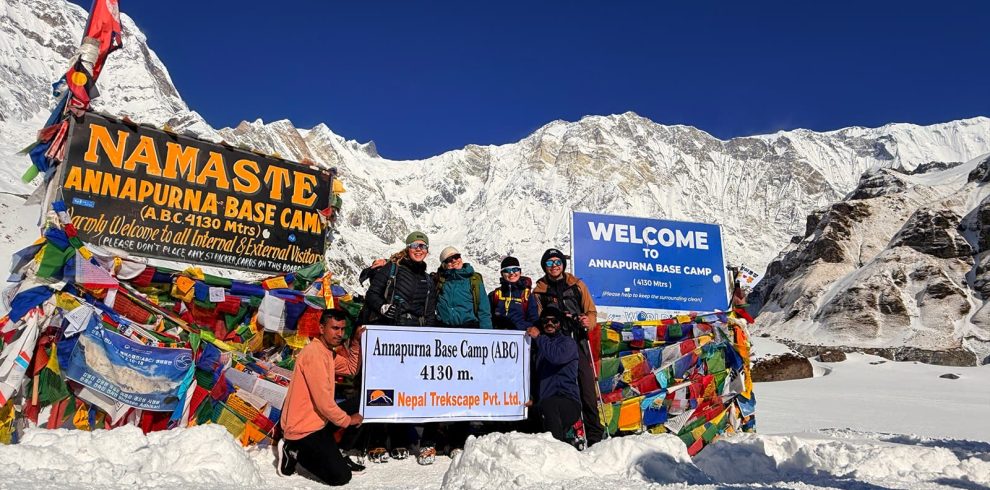 Trekkers with lead guide and owner of Nepal Trekscape Ajit Adhikari at Annapurna Base Camp during the Annapurna Base Camp Trek in Nepal