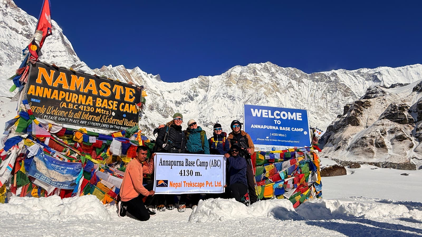 Trekkers with lead guide and owner of Nepal Trekscape Ajit Adhikari at Annapurna Base Camp during the Annapurna Base Camp Trek in Nepal