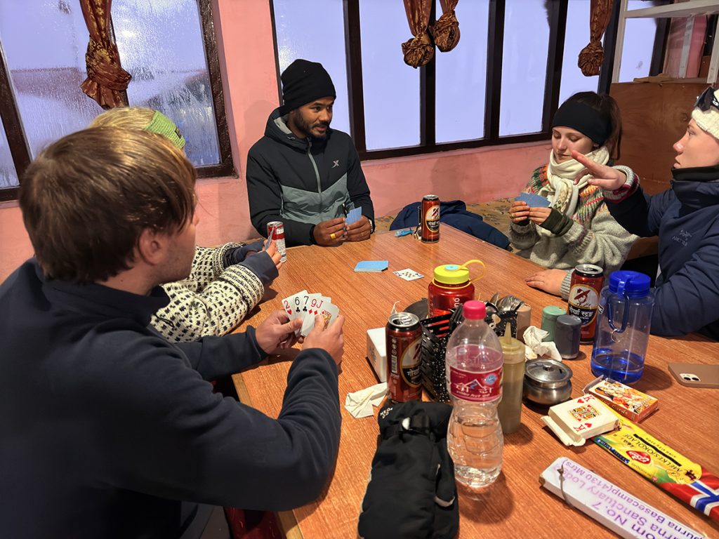 Trekkers at communal dinning hall of teahouse during Annapurna Base Camp Trek